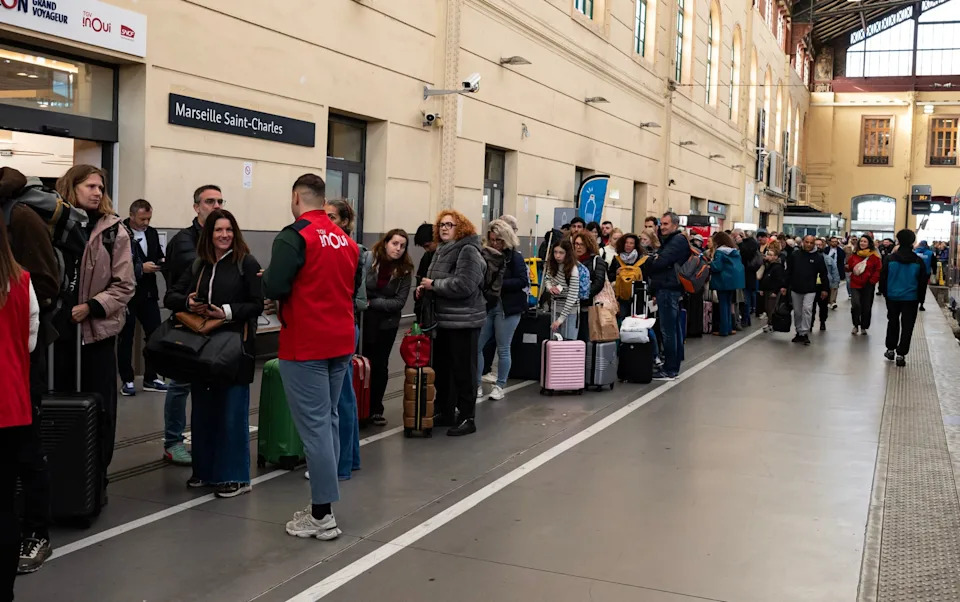 Passengers queue at Saint Charles train station in Marseille