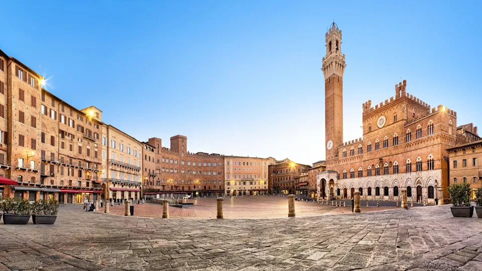 Panorama of Siena, Italy. Piazza del Campo square with gothic town hall building and tower