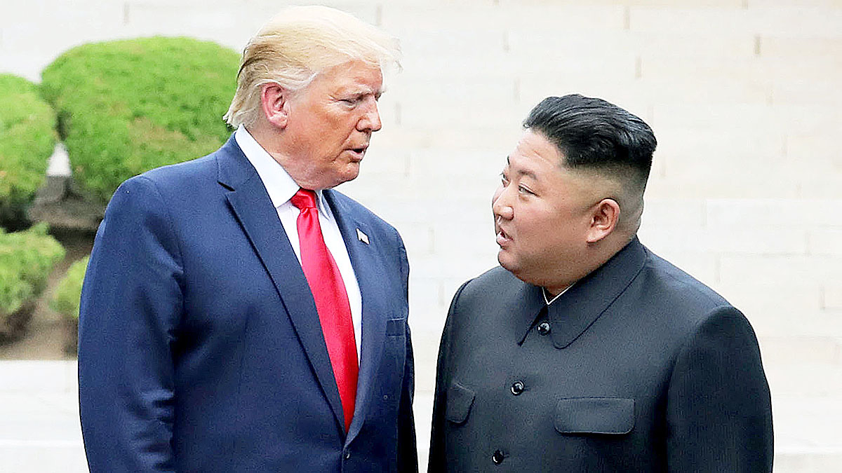North Korean leader Kim Jong-un, right, and U.S. President Donald Trump, left, converse during a summit at Panmunjom on Jan. 1, 2020. [YONHAP]