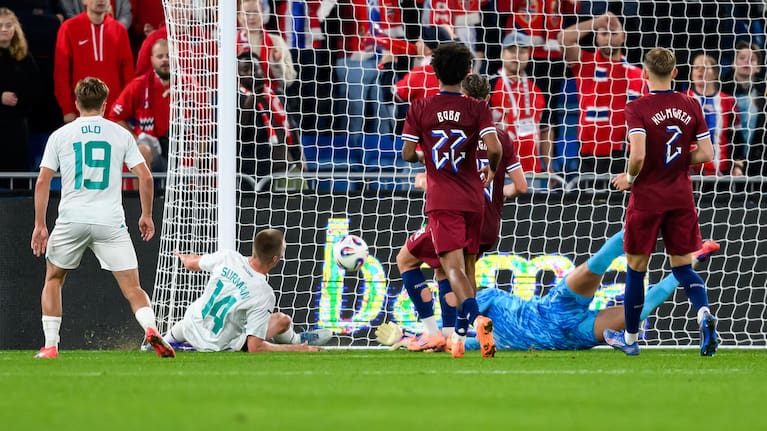 Finn Surman of New Zealand scores a goal against Norway. 