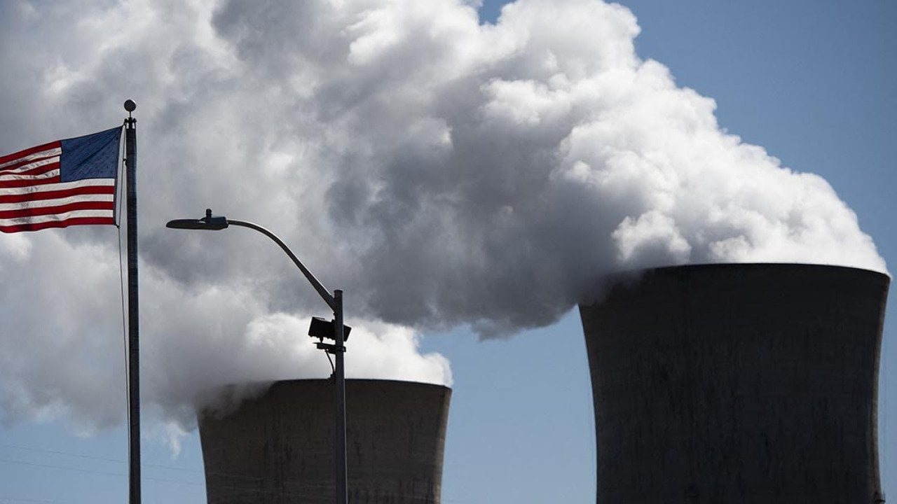Steam rises out of the nuclear plant on Three Mile Island, with the operational plant run by Exelon Generation, in Middletown, Pennsylvania on March 26, 2019, forty years after the three mile island meltdown.