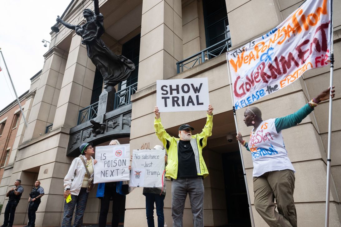 Demonstrators are seen outside the US District Courthouse in Alexandria, Virginia, on Wednesday.