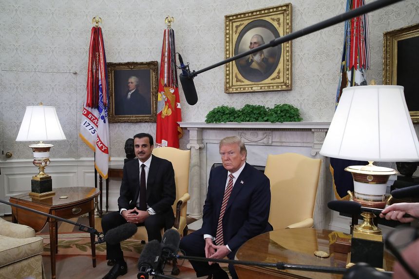 US President Donald Trump meets with the Emir of Qatar Sheikh Tamim bin Hamad Al Thani in the Oval Office of the White House, on April 10, 2018.