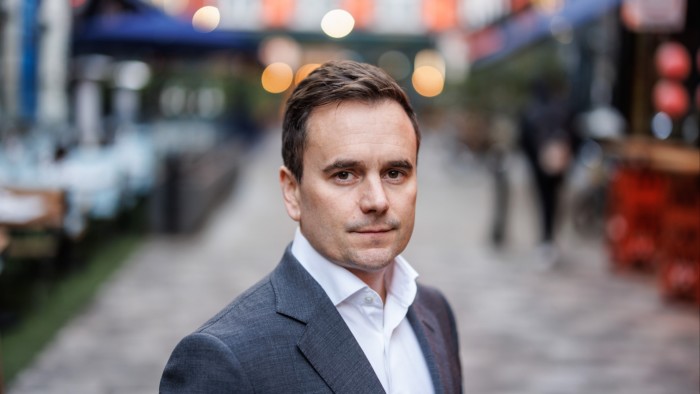 Richard Walker stands outdoors in central London.