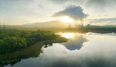 Aerial view coal power plant station in the morning mist.