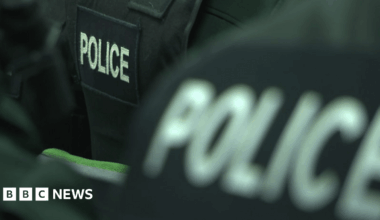 Bilingual street sign damaged with angle grinder