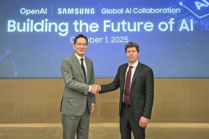 Samsung Electronics Chairman Lee Jae-yong (left) shakes hands with OpenAI CEO Sam Altman after signing a letter of intent (LOI) to cooperate in building a global AI infrastructure