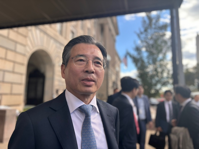 South Korea’s Presidential Policy Chief Kim Yong-beom meets the press as he leaves the Commerce Department building after meeting with Secretary Howard Lutnick on Oct. 22, 2025