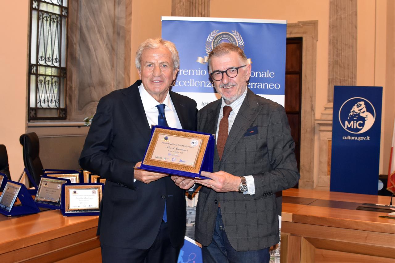 At the ceremony held at the Italian Ministry of Culture, former Turkish Football Federation (TFF) President and ex-UEFA Executive Committee member Servet Yardimci (left) was presented with his award by Charles Camenzuli (right), President of the European Region of the International Sports Writers Association (AIPS). Rome, Italy, October 20, 2025. (AA Photo)