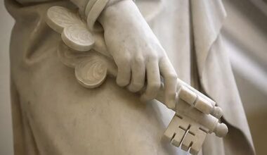 Marble statue holding symbolic keys, representing apostolic succession and priesthood keys of authority.