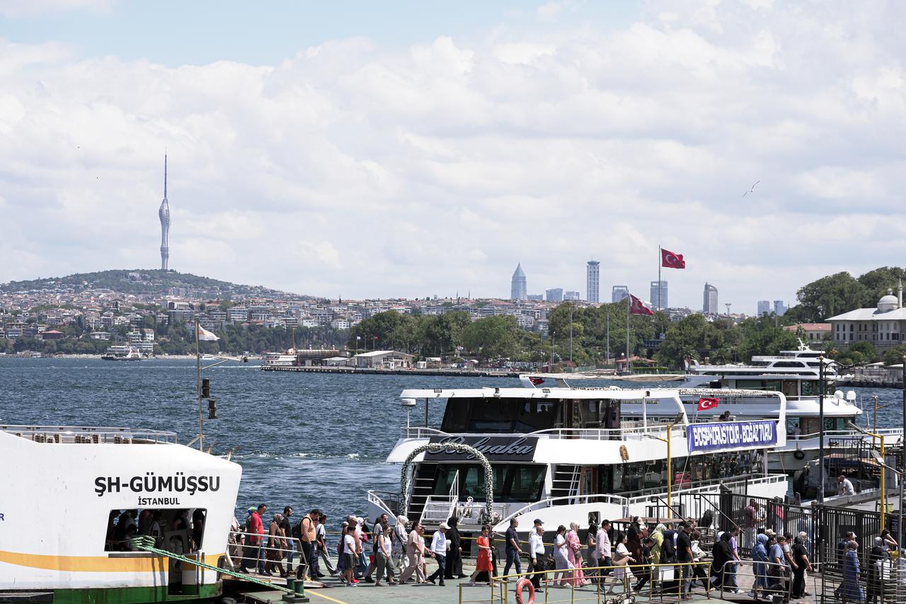 Passengers crossing from the European side to the Anatolian side disembark the ferry as daily life continues in Istanbul, Türkiye on July 31, 2025. (AA Photo)