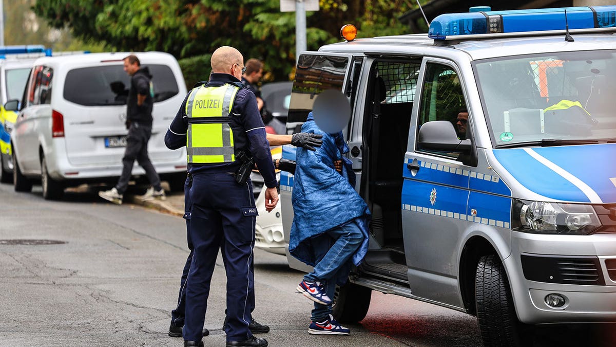 German elect mayor's children are taken in for questioning