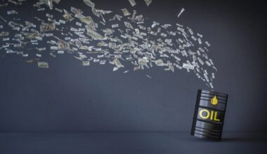money flying out of an oil drum
