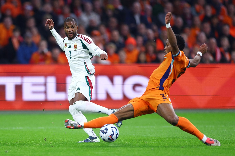 AMSTERDAM, NETHERLANDS: Loic Nego of Hungary is challenged by Jurrien Timber of Netherlands during the UEFA Nations League 2024/25 League A Group A3 match between Netherlands and Hungary at the Johan Cruijff Arena on November 16, 2024. (Photo by Dean Mouhtaropoulos/Getty Images)