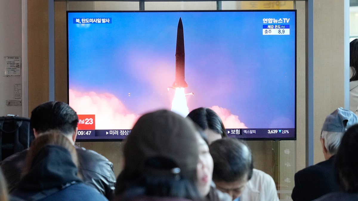 People in South Korea watch news coverage of North Korea missile launch