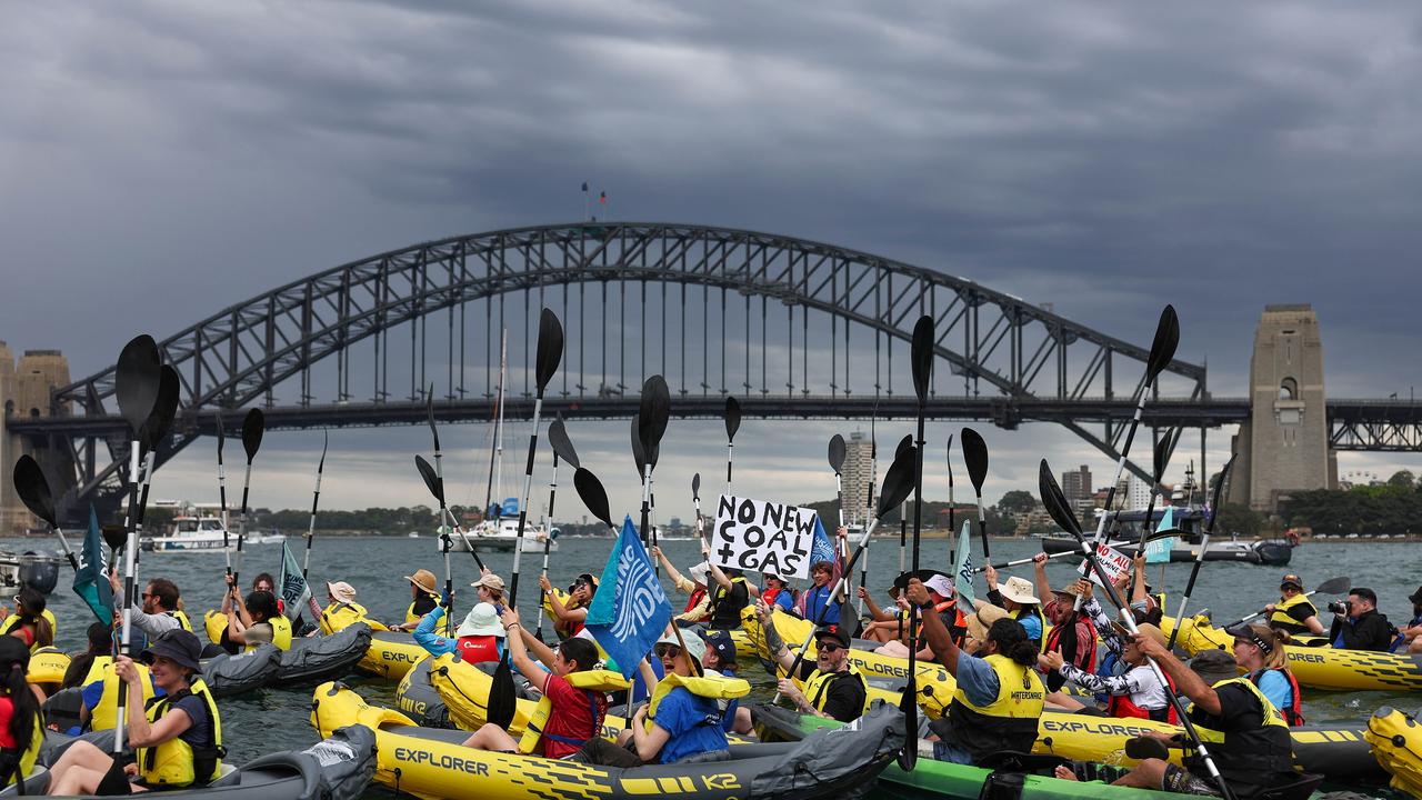 Activist group paddles across Sydney Harbour to demand no new coal or gas projects