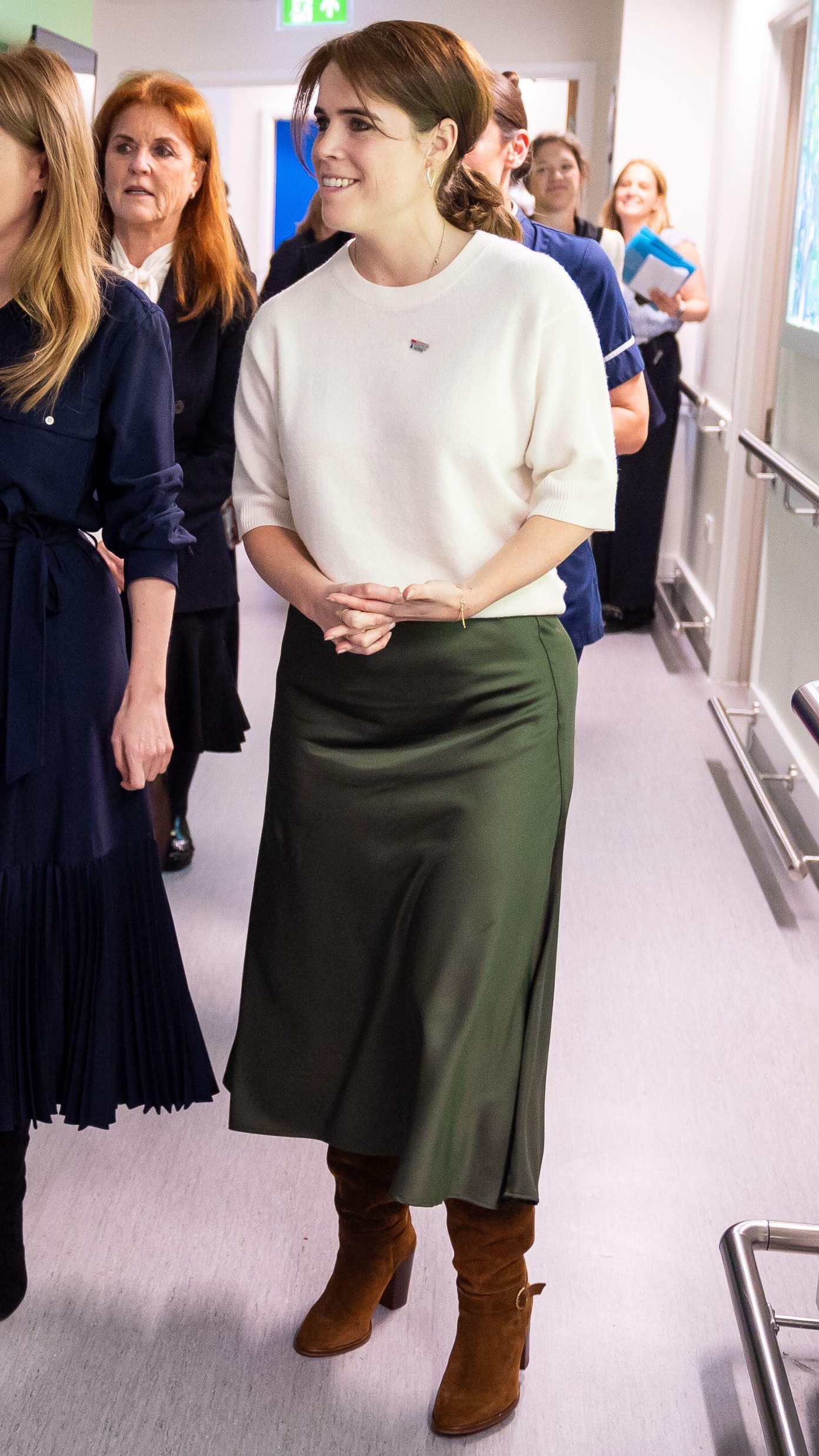 Princess Eugenie speaks to a nurse during a visit to the Teenage Cancer Trust unit at University College Hospital