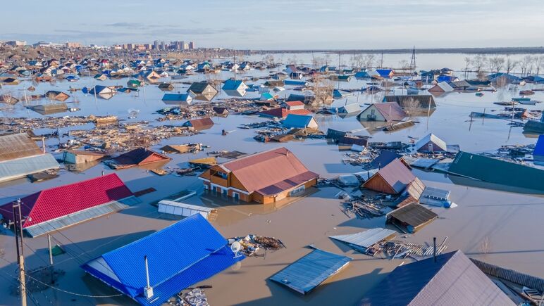Flooded homes along a coastline.
