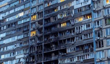 A block of flats in Kyiv caught fire after being hit. Pic: Reuters