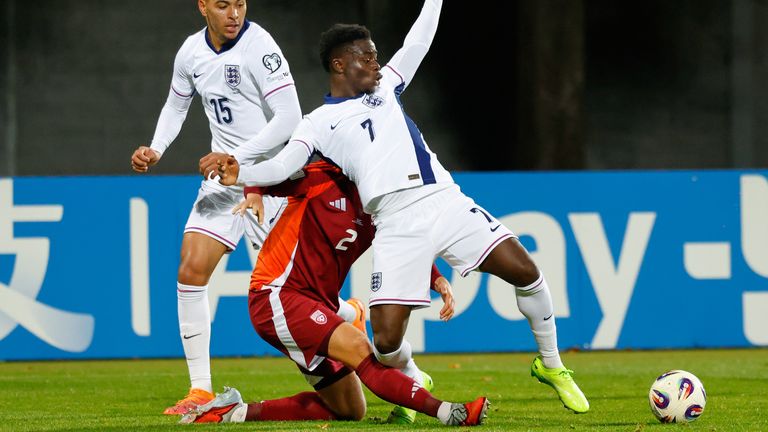 Bukayo Saka is challenged by Latvia's Daniels Balodis. Pic: AP