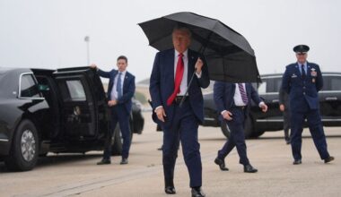 President Donald Trump walks over to speak with reporters before boarding Air Force One, Sunday, Oct. 12, 2025, at Joint Base Andrews, Md., as he heads to the Middle East. (AP Photo/Evan Vucci)