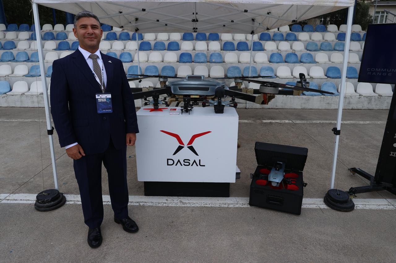 DASAL Aviation General Manager Murat Koc stands with reconnaissance drone equipment during NATOs Innovation Continuity Initiative exercise in Istanbul, Türkiye on Oct. 18, 2025. (AA Photo)