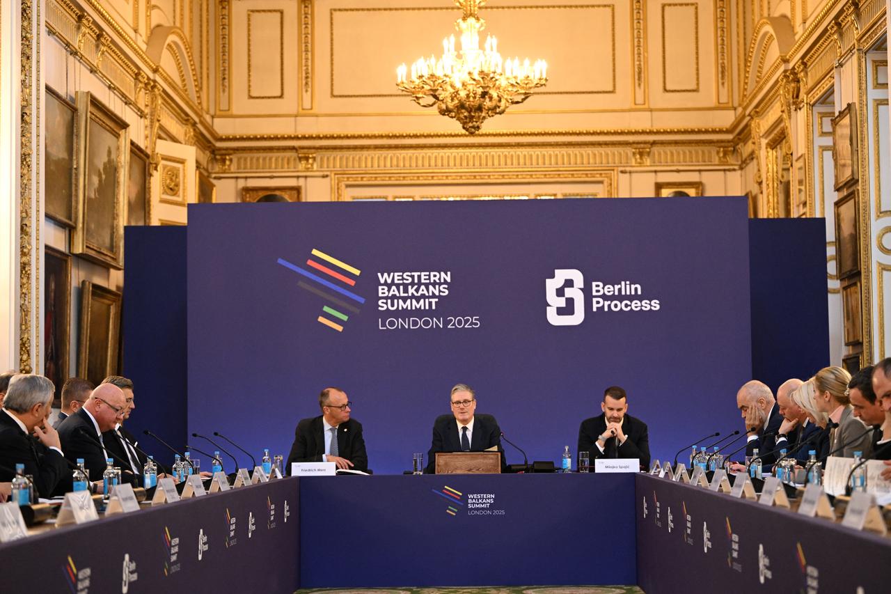 Britains Prime Minister Keir Starmer (C) flanked by German Chancellor Friedrich Merz (CL) and Montenegros Prime Minister Milojko Spajic (CR) hosts the plenary session of the Western Balkans Summit in central London, United Kingdom on October 22, 2025. (AFP Photo)