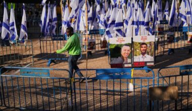 The Latest: Israel to halve aid into Gaza over slow return of dead hostages