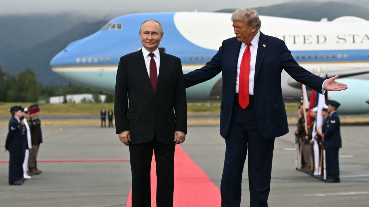 US President Donald Trump (R) and Russian President Vladimir Putin pose on a podium on the tarmac after they arrived at Joint Base Elmendorf-Richardson in Anchorage, Alaska, on August 15, 2025. Putin is in Alaska at the invitation of Trump in his first visit to a Western country since he ordered the 2022 invasion of Ukraine that has killed tens of thousands of people. (Photo by ANDREW CABALLERO-REYNOLDS / AFP)