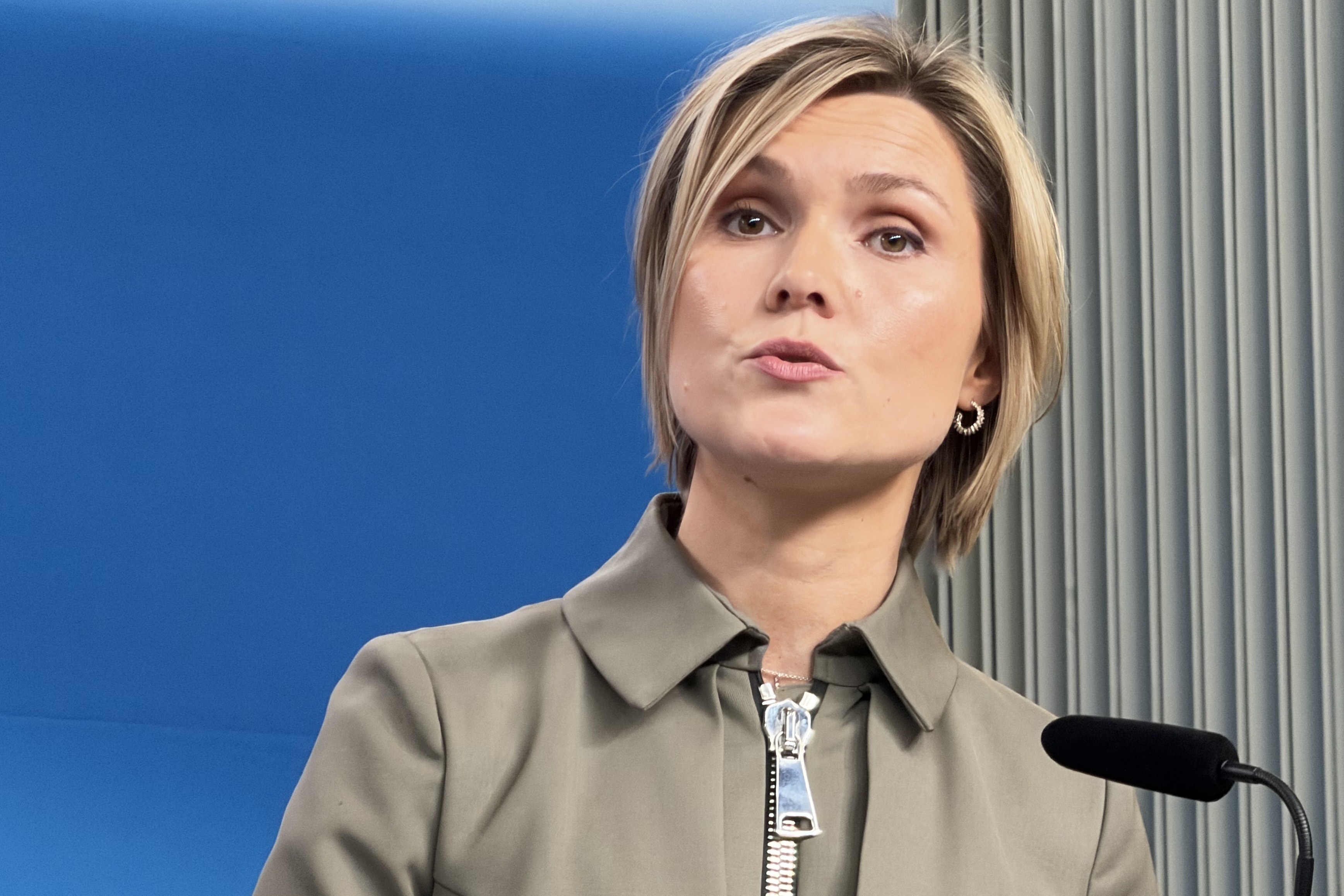 Icelandic Prime Minister Kristrun Frostadottir delivering a speech at a press conference.