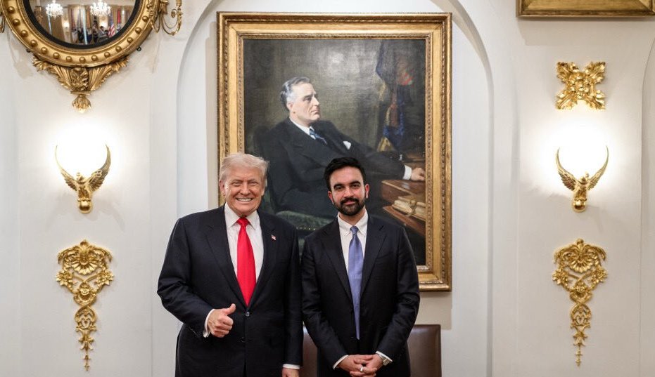 Donald Trump and David Perdue pose for a photo.