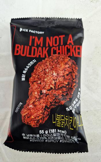 What appears to be a breaded chicken drumstick is sealed in plastic.