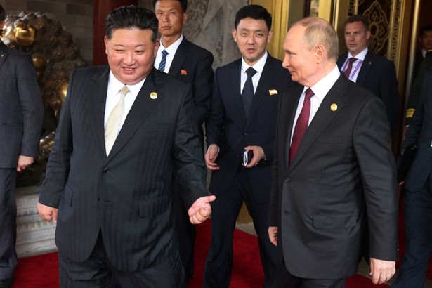 Putin meets North Korea puppet for 'outcast handshake' as they're choked with sanctions