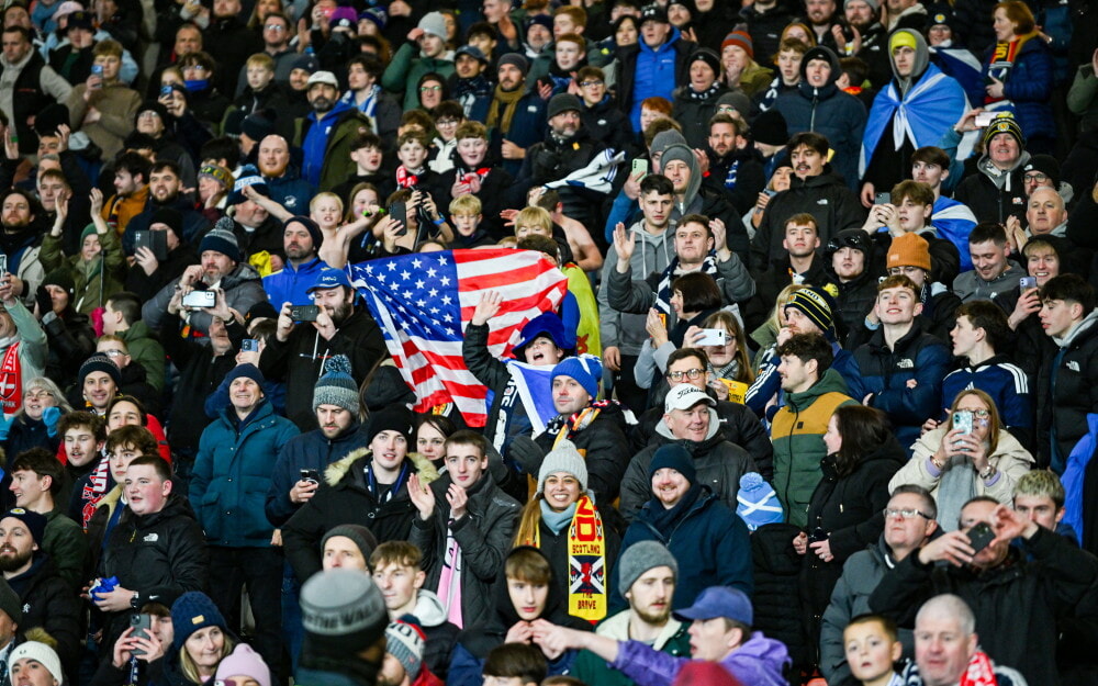 Fans celebrate at full time as Scotland seals spot at World Cup, which is set to be held in the US, Canada and Mexico next summer
