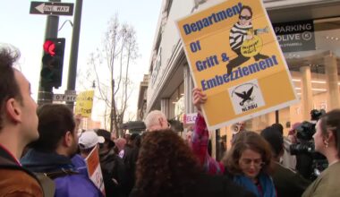 Federal workers protest outside Tesla showroom in San Francisco; Musk defends cuts