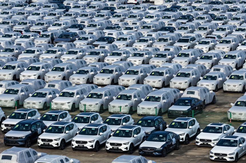 Vehicles wait to be loaded on a ship for export at Nanjing Port in eastern China earlier this month.
