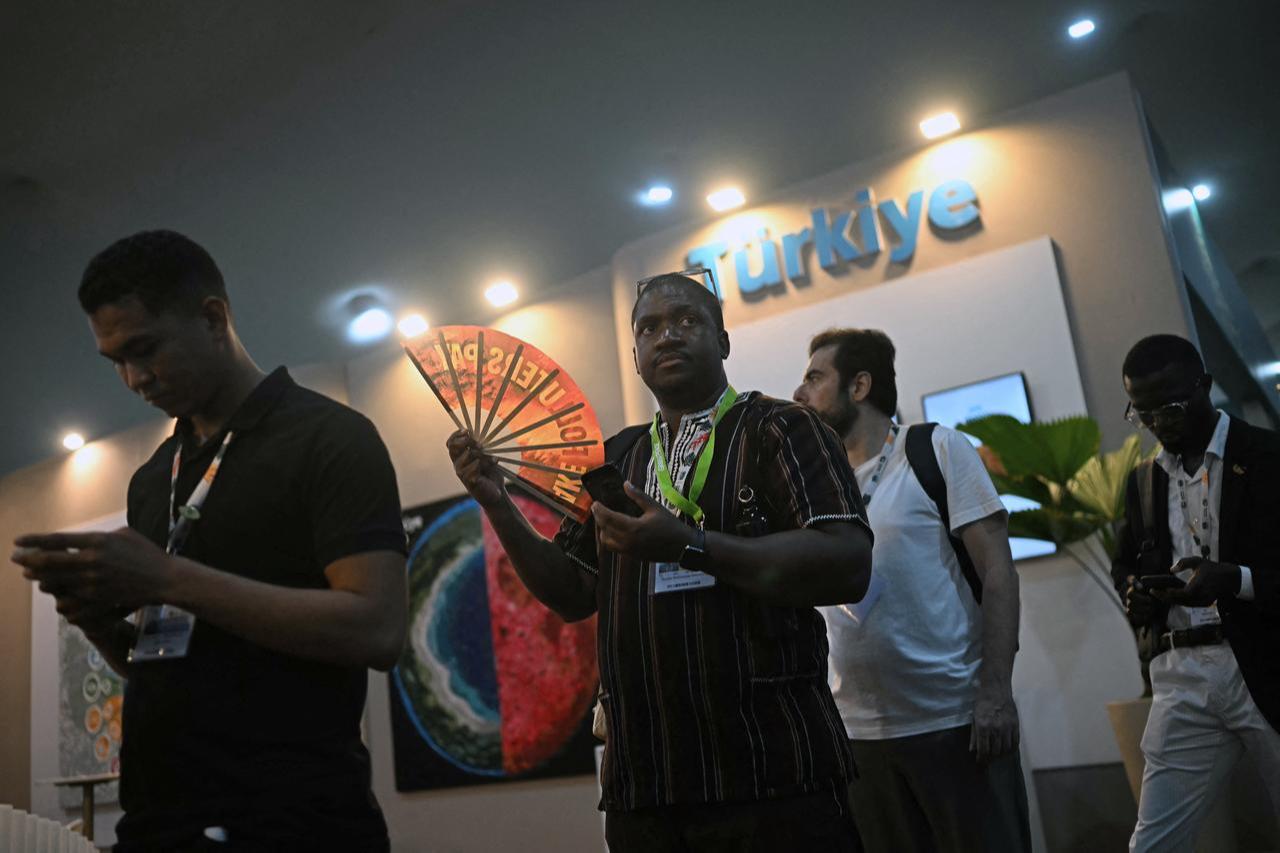 Men visit the Türkiye's pavilion at the COP30 UN Climate Change Conference in Belem, Para State, Brazil on November 13, 2025. (AFP Photo)