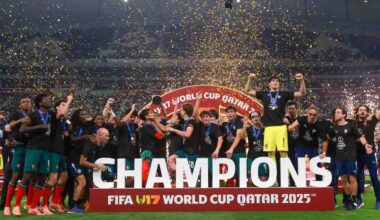 Portugal's players celebrate with the trophy on the podium after the FIFA U17 World Cup final football match between Portugal and Austria at Khalifa International Stadium in Al-Rayyan on November 27, 2025. (Photo by Karim JAAFAR / AFP)