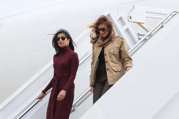 Second lady Usha Vance (L) and first lady Melania Trump depart a plane at Albert J. Ellis Airport