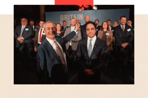 Carl Court /Getty Images Reform UK leader, Nigel Farage (L) and Chairman of Reform UK, Zia Yusuf (R), pose for a picture in front of councillors