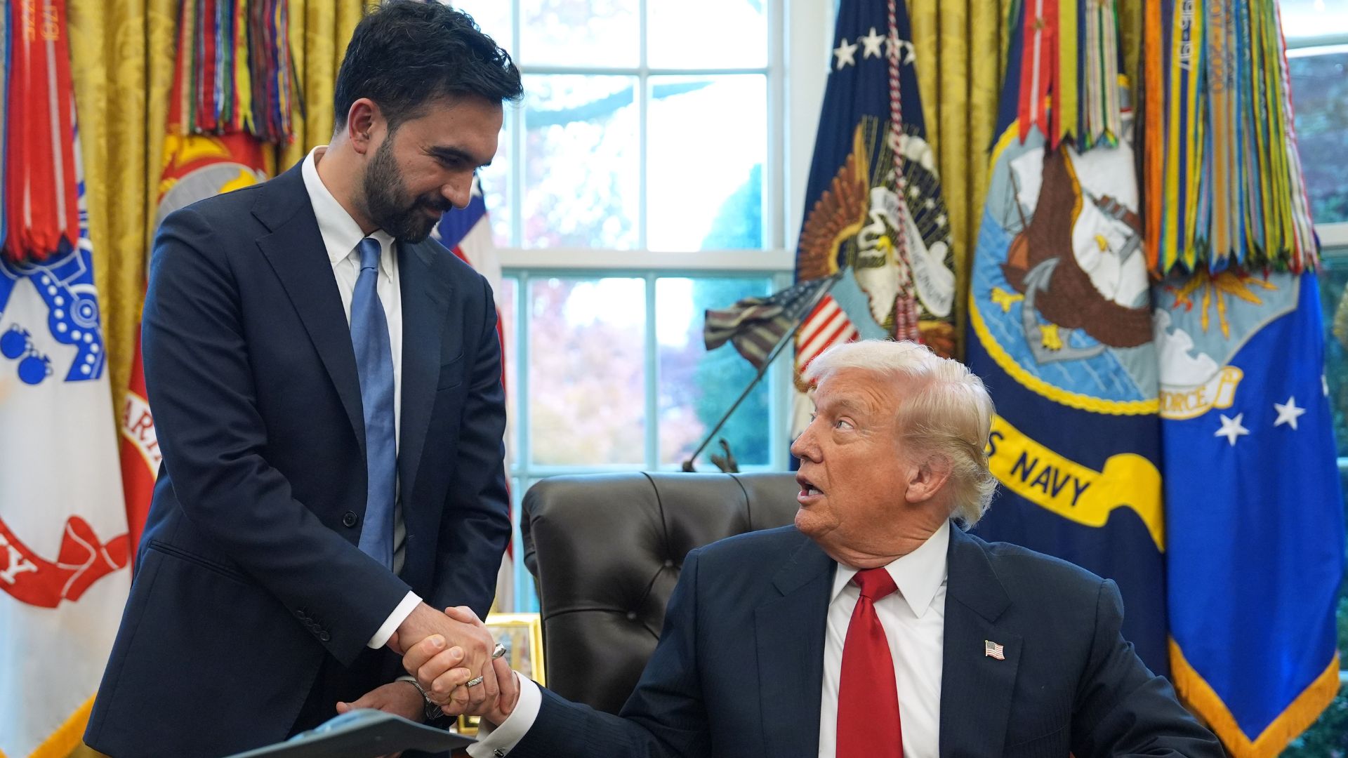President Donald Trump shakes hands with New York City Mayor-elect Zohran Mamdani in the Oval Office of the White House, Friday, Nov. 21, 2025, in Washington.