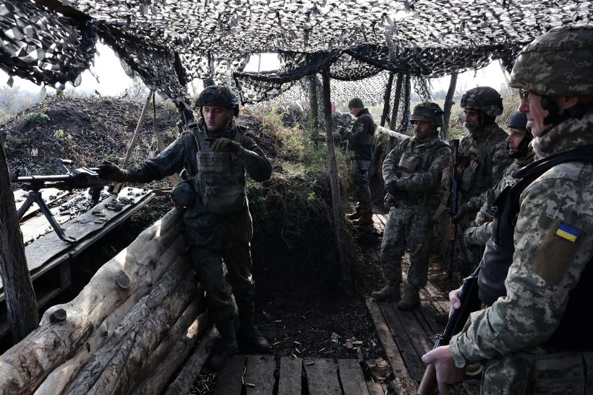 An instructor shows recruits of the 65th Separate Mechanized Brigade of the Ukrainian Armed Forces an FN MAG machine gun during a military exercise at a training ground in Zaporizhzhia region, Ukraine November 5, 2025.