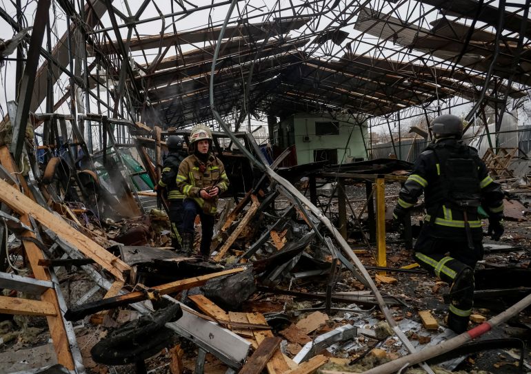 Rescuers work at the site of a Russian drone strike, amid Russia's attack on Ukraine, in Kharkiv, Ukraine November 12, 2025