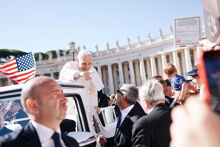 Pope Leo XIV spies a pizza sign in the middle of Vatican Square.