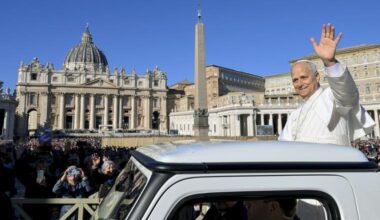 Pope Leo waves to the crowd in attendance for his Nov. 12 general audience.