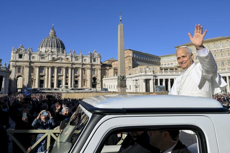 Pope Leo waves to the crowd in attendance for his Nov. 12 general audience.