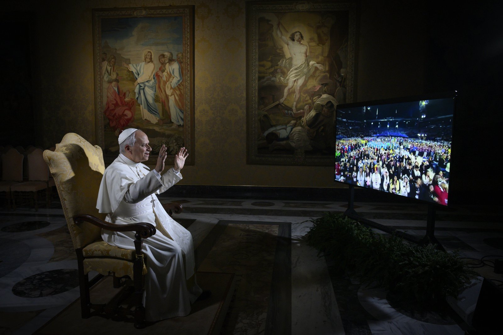 Pope Leo XIV waves at 16,000 young people gathered at the National Catholic Youth Conference in Indianapolis as he holds a livestreamed question-and-answer session with them from the Vatican on Nov. 21. (CNS photo/Vatican Media)
