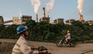 Workers ride motorbikes in the morning of April 18, toward Weda Bay Industrial Park (WBIP), a major nickel-processing and smelting hub, in Lelilef Sawai, Central Halmahera, North Maluku.