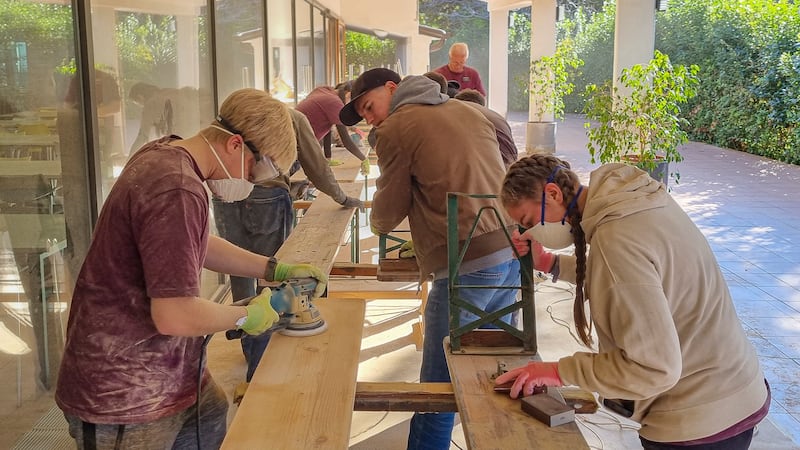 Missionaries from the Adriatic North Mission sand boards for new benches at the Debeli Rtič Health Resort on the Adriatic Sea in Slovenia on Friday, Nov. 7, 2025.