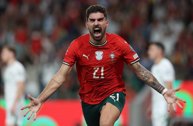 Ruben Neves celebrates scoring a late winner for Portugal. Photograph: Carlos Rodrigues/Getty Images